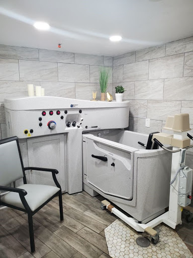 A hyperbaric chamber setup in a treatment room, designed for therapeutic use.