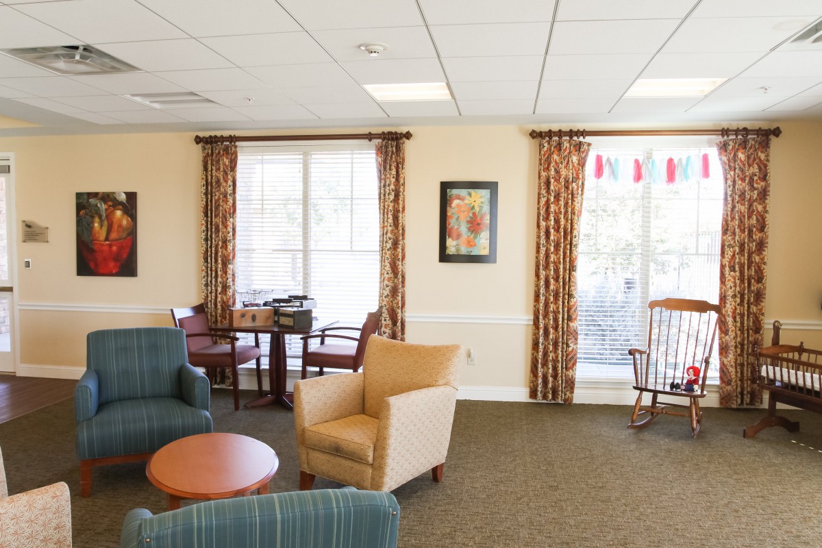 A cozy living room with comfortable seating and large windows.