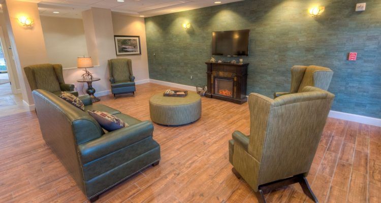 A cozy living room with comfortable seating and a fireplace.