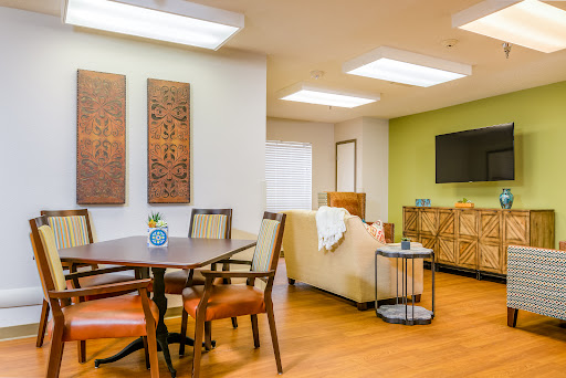 A stylish and cozy living room featuring modern furniture and decorative elements.