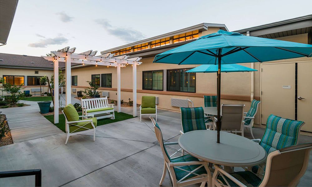 A cozy patio area with seating and umbrellas, perfect for relaxation.