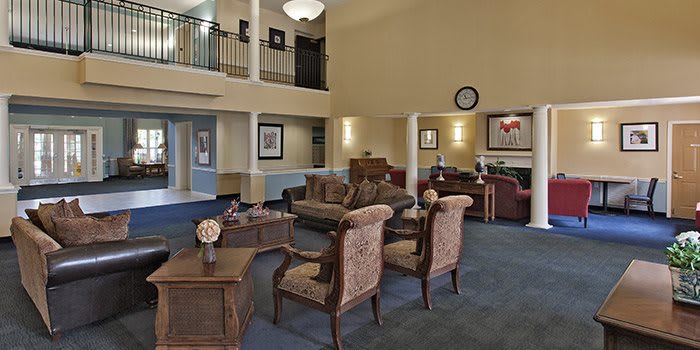 A spacious and elegantly decorated lobby area with comfortable seating and warm lighting.