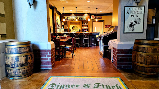 A welcoming view of the interior of Digger & Finch, featuring a cozy dining area and bar.