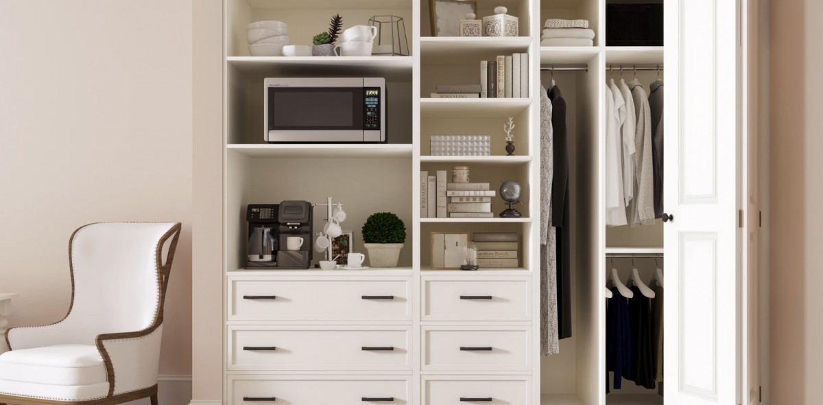 A well-organized kitchen shelving unit with a microwave, books, and various kitchen items.