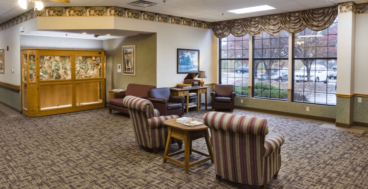 A cozy lobby area featuring comfortable seating and decorative elements.