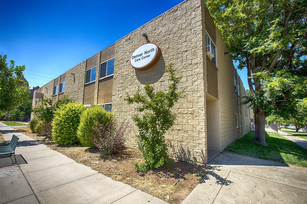 Exterior view of a school building on a sunny day.