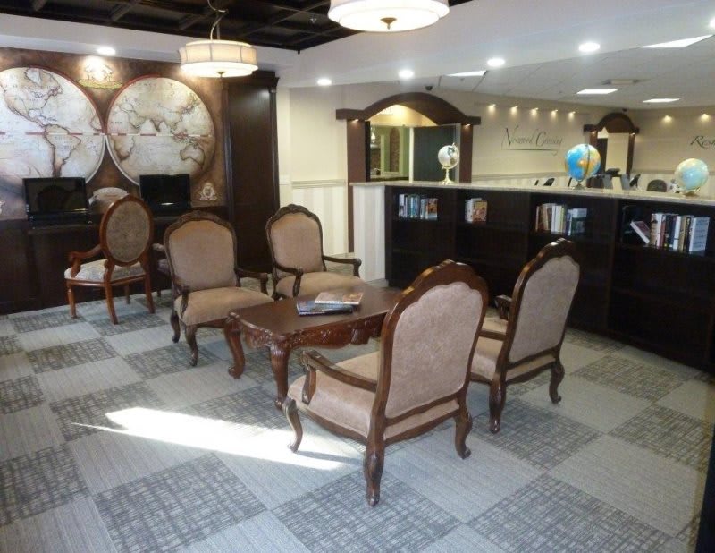 A comfortable lobby area with elegant furniture and a reception desk.
