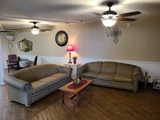 A cozy living room setup featuring comfortable sofas and a warm ambiance.