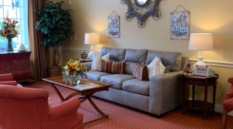 A cozy living room with a comfortable sofa, coffee table, and decorative elements.