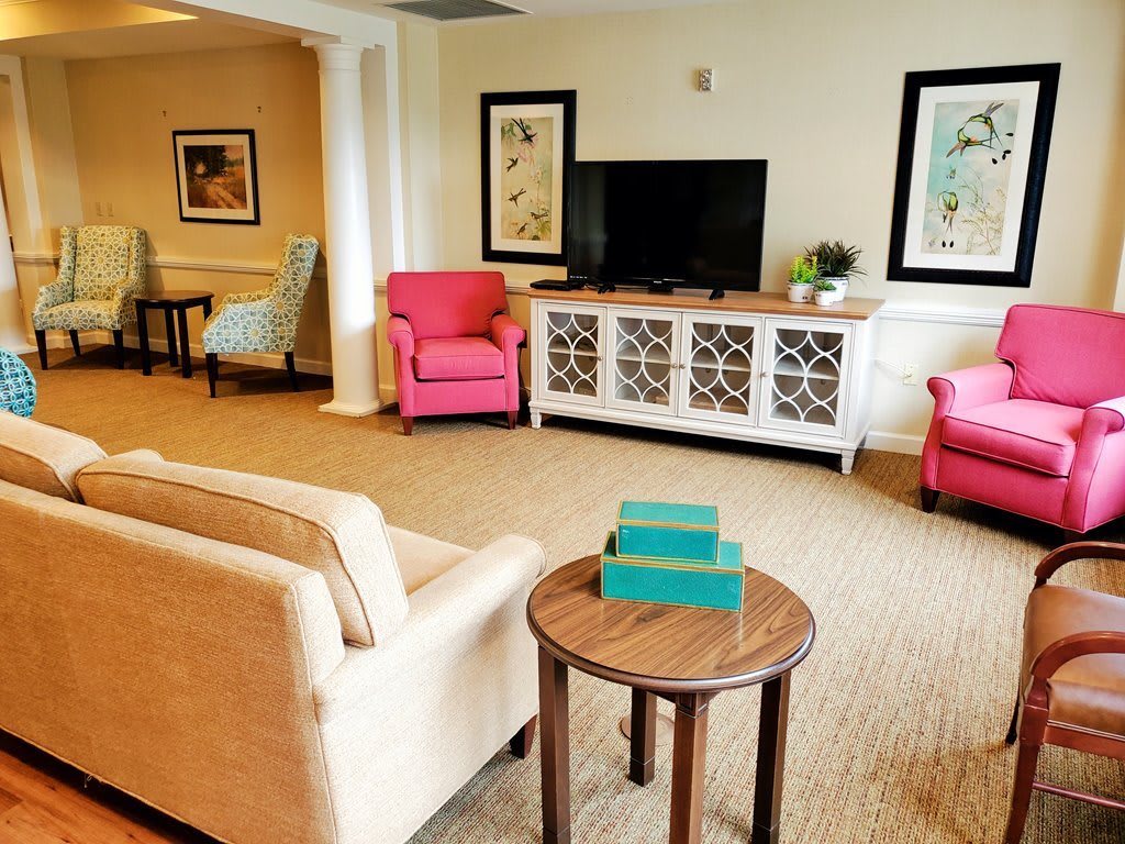 A cozy living room with comfortable seating and a television.