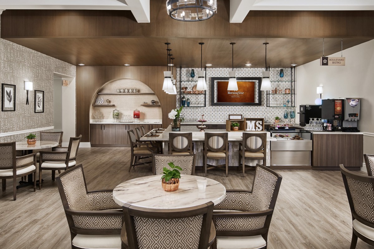 A modern kitchen and dining area with elegant decor and stylish lighting.