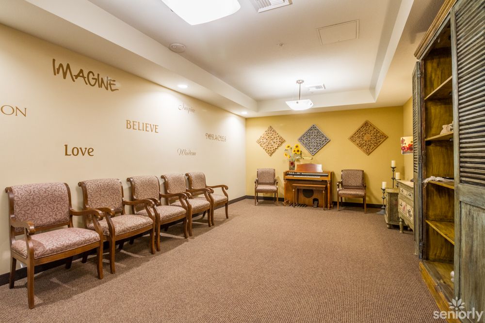 An inviting waiting room with neatly arranged chairs and warm lighting.
