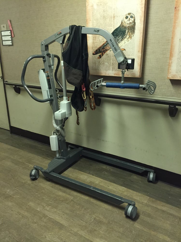A patient lift used for assisting individuals with mobility challenges in a healthcare setting.