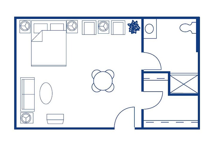 A simple floor plan depicting a compact apartment layout including a bedroom, kitchen, living area, and bathroom.