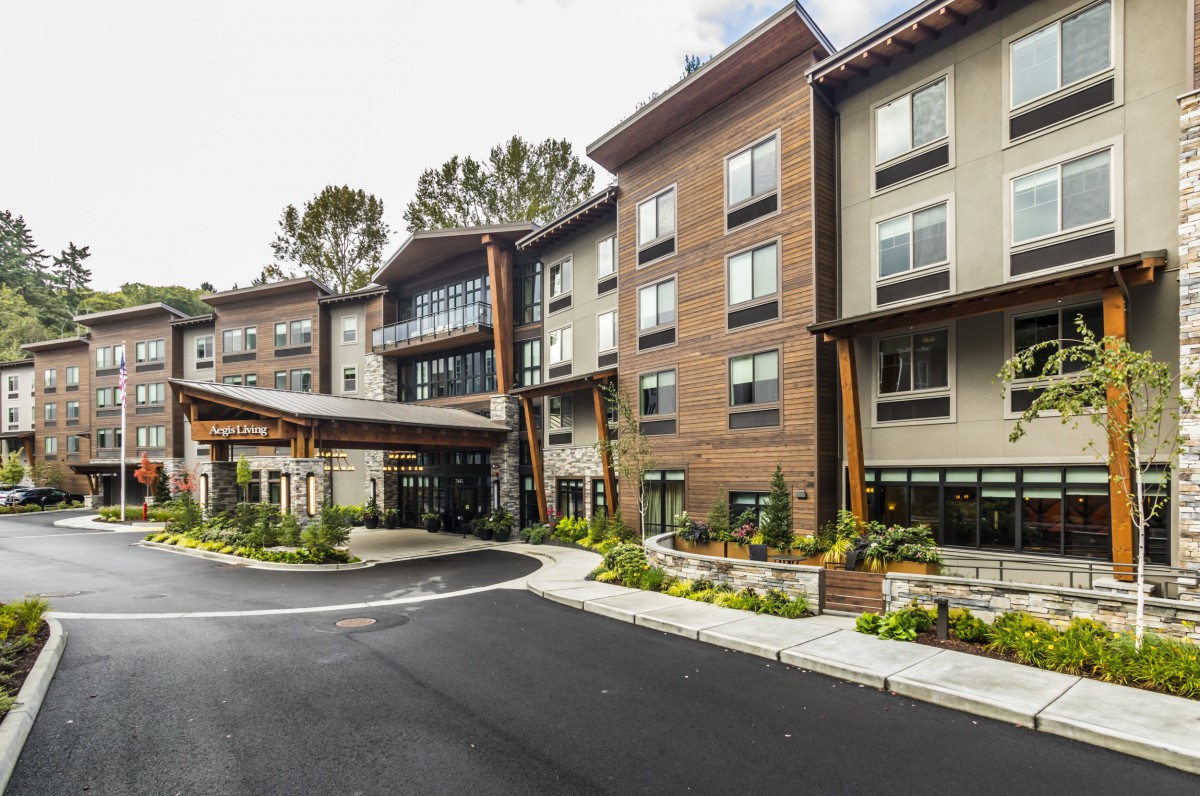 The exterior view of a modern hotel with landscaped surroundings.