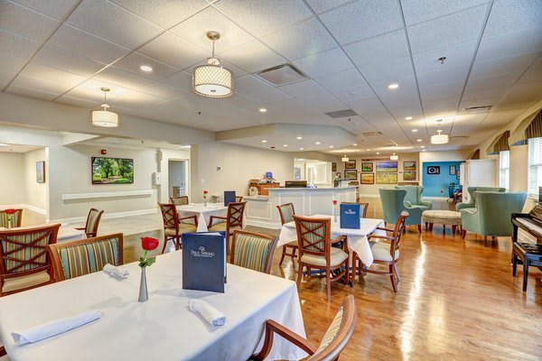 An elegant dining area in a restaurant with neatly arranged tables and comfortable chairs.