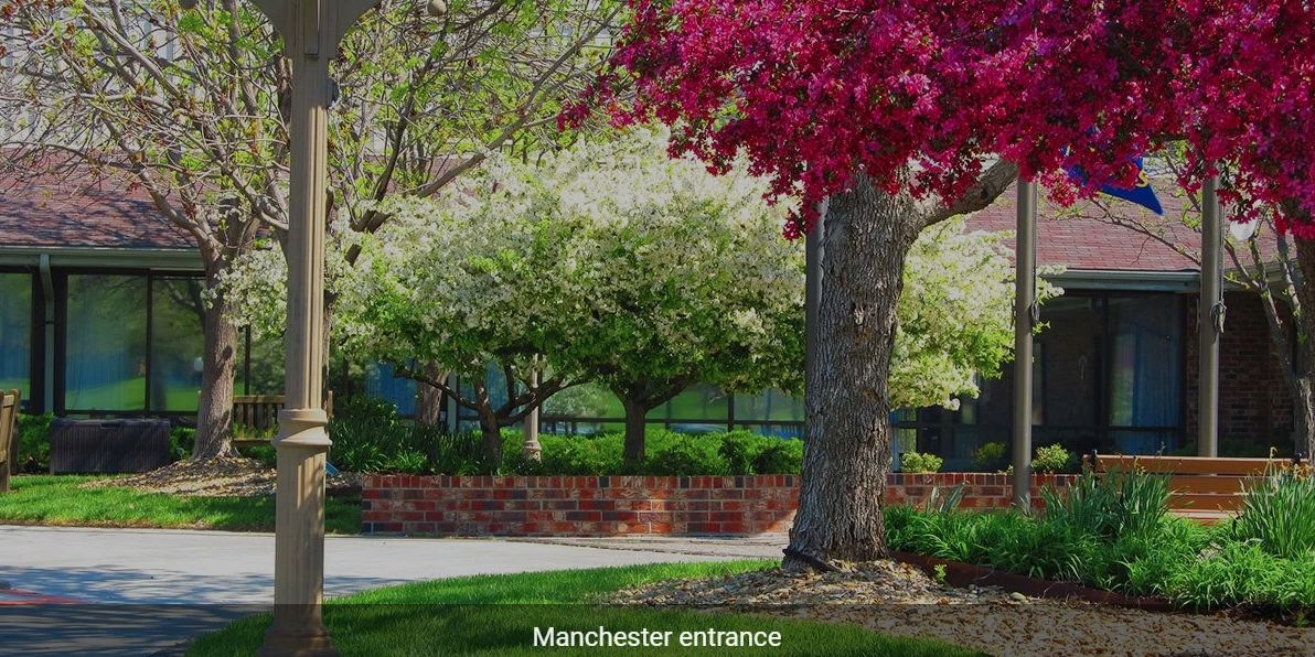 A colorful spring landscape at the Manchester entrance.