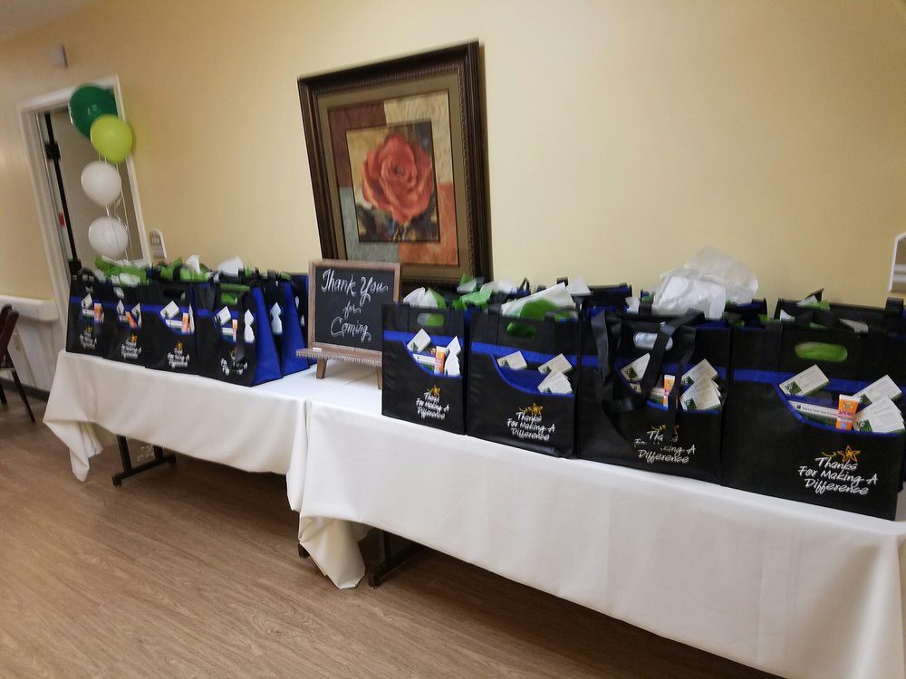 A neatly arranged table with gift bags prepared for an event.