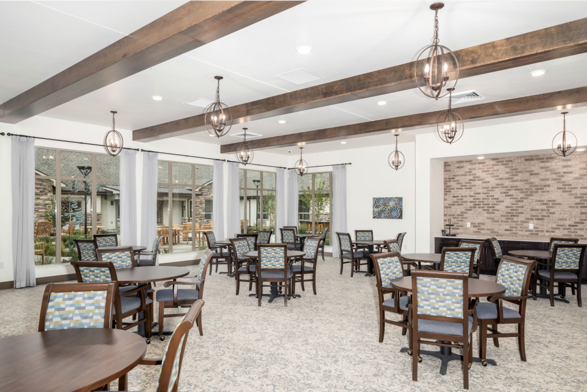 A spacious dining room with elegant decor and ample seating.