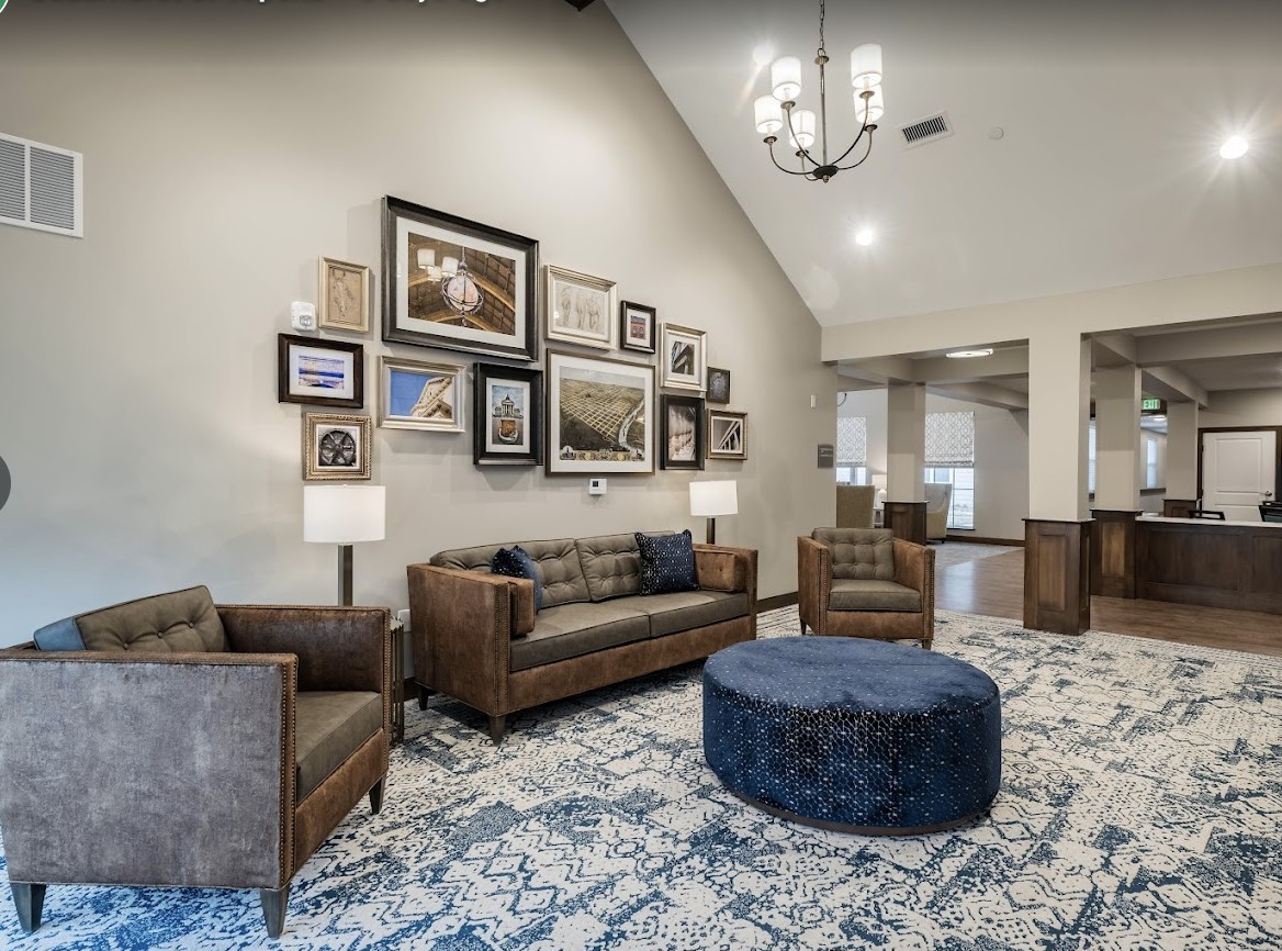A stylish living room with comfortable seating and decorative wall art.