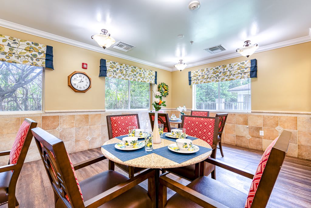 A cozy dining room with a well-set table and vibrant decor.
