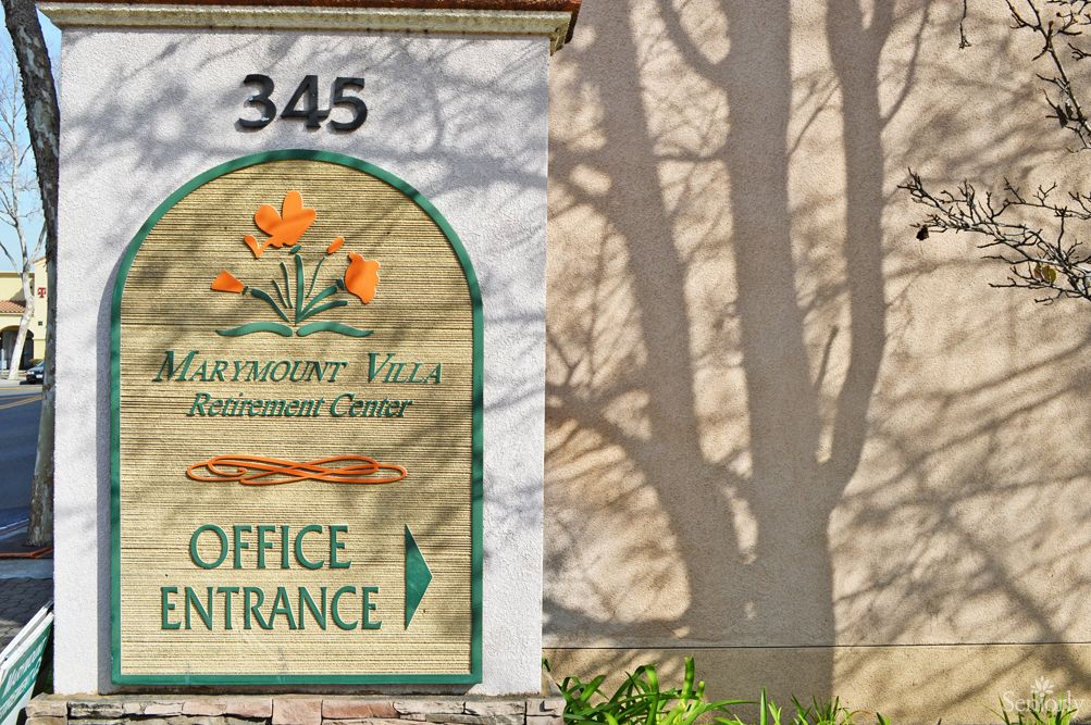 Sign for Claremont Villa with an office entrance indication.