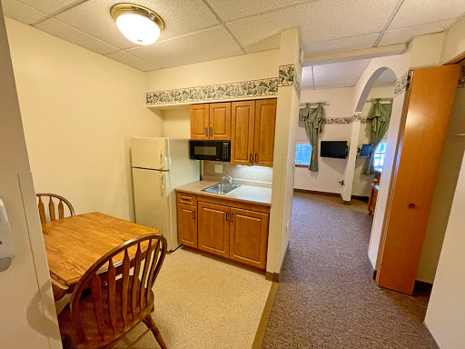 Cozy kitchen area with dining space and essential appliances.