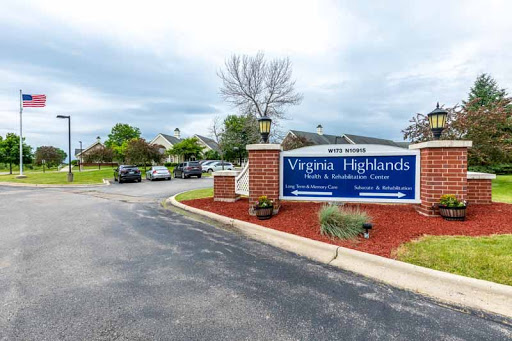 Entrance to the Virginia Highlands community, featuring well-maintained landscaping and a welcoming sign.