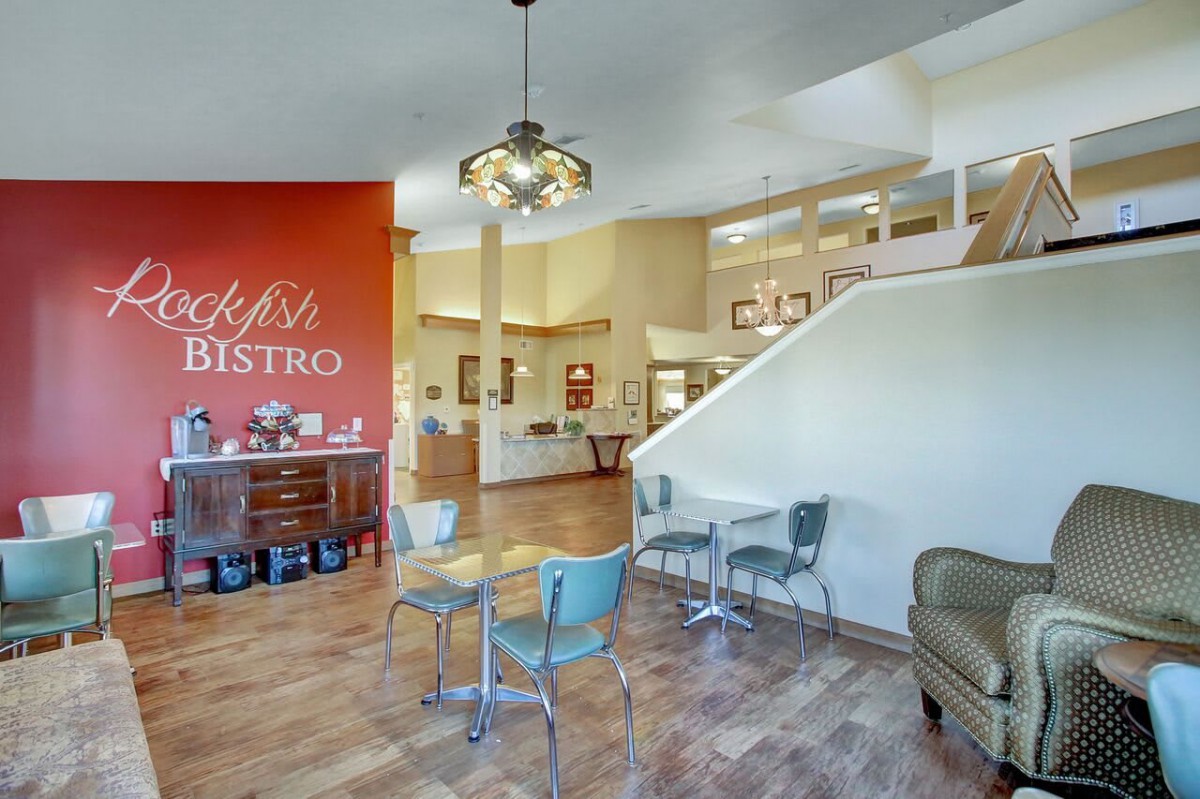 A cozy bistro interior with colorful chairs and modern decor.