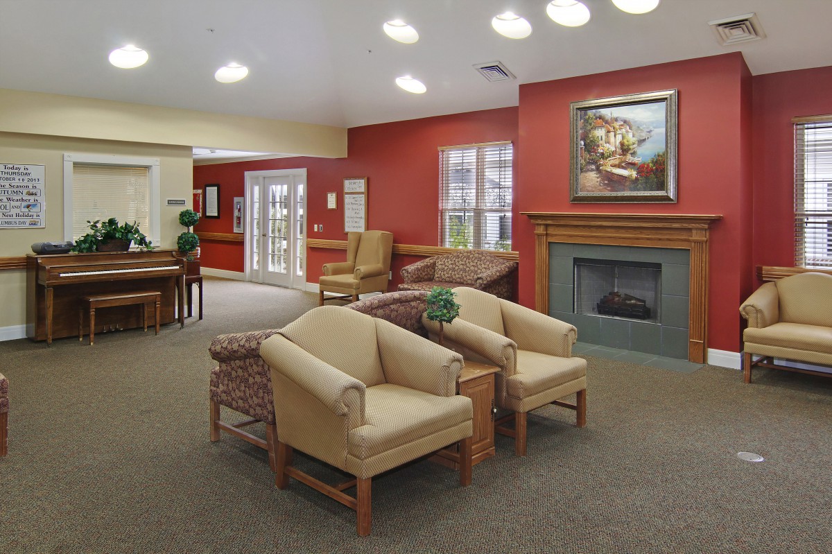 A cozy living room with comfortable seating and a fireplace.