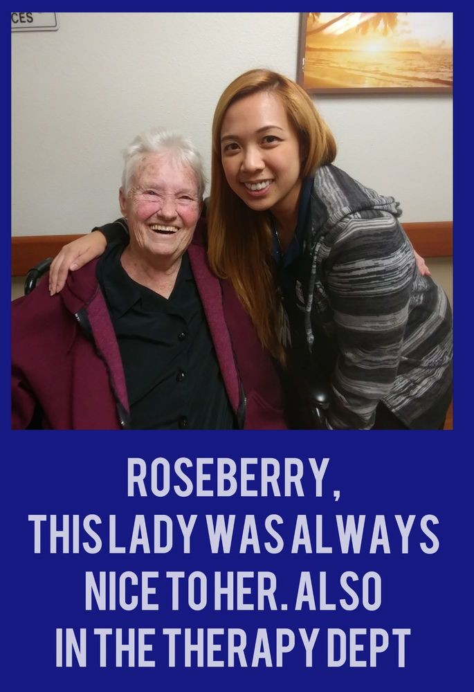 Two people smiling and posing for a photo together.