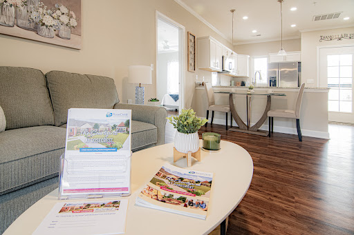 A stylish modern living space showcasing an open concept design with comfortable furnishings and decor.