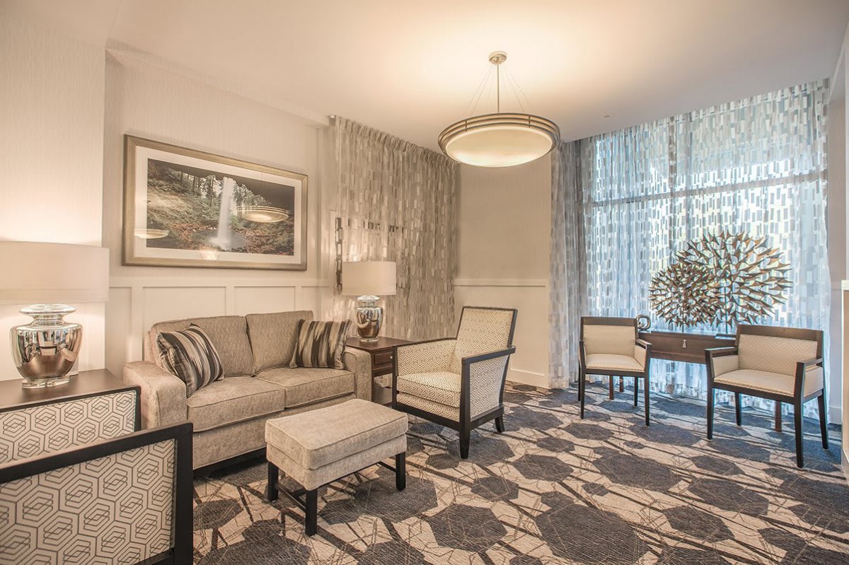 Elegant living room with modern furniture and soft lighting.