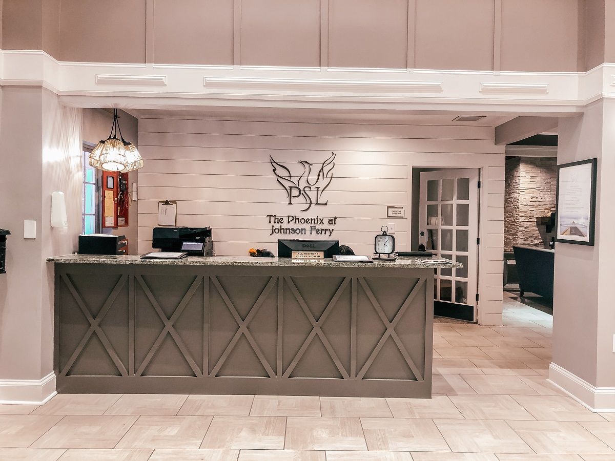 Modern reception area with a welcoming desk and stylish interior design.