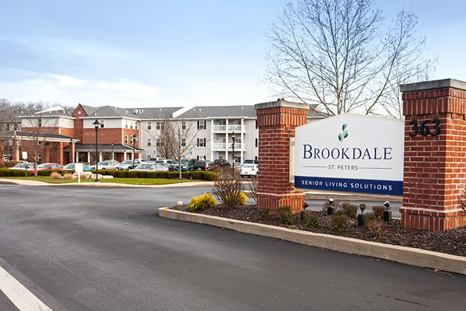 Entrance to a residential complex with a sign for Brookdale Senior Living.