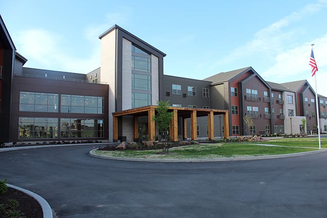 A modern building with large glass windows and a welcoming entrance.