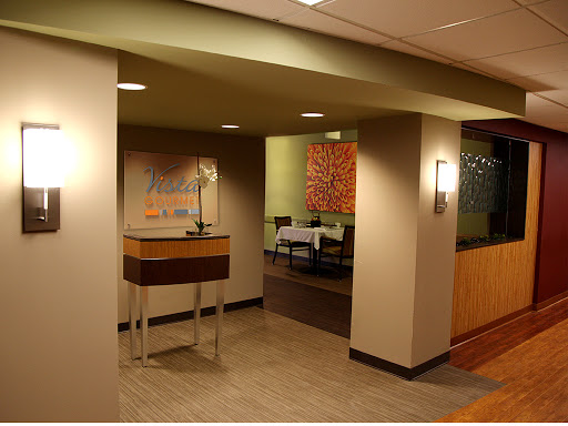 A stylish and modern dining area entrance with ambient lighting.
