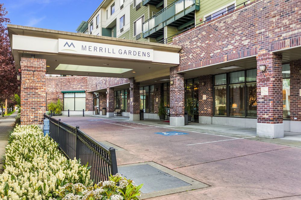 The entrance to Merrill Gardens with its welcoming architecture and landscaped surroundings.