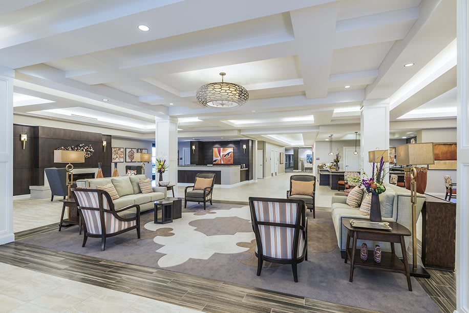 A modern hotel lobby with elegant furniture and decor.
