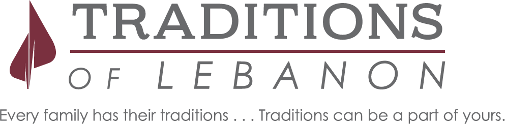 A partial view of a business logo with the word 'TRADITIO' visible against a dark background.