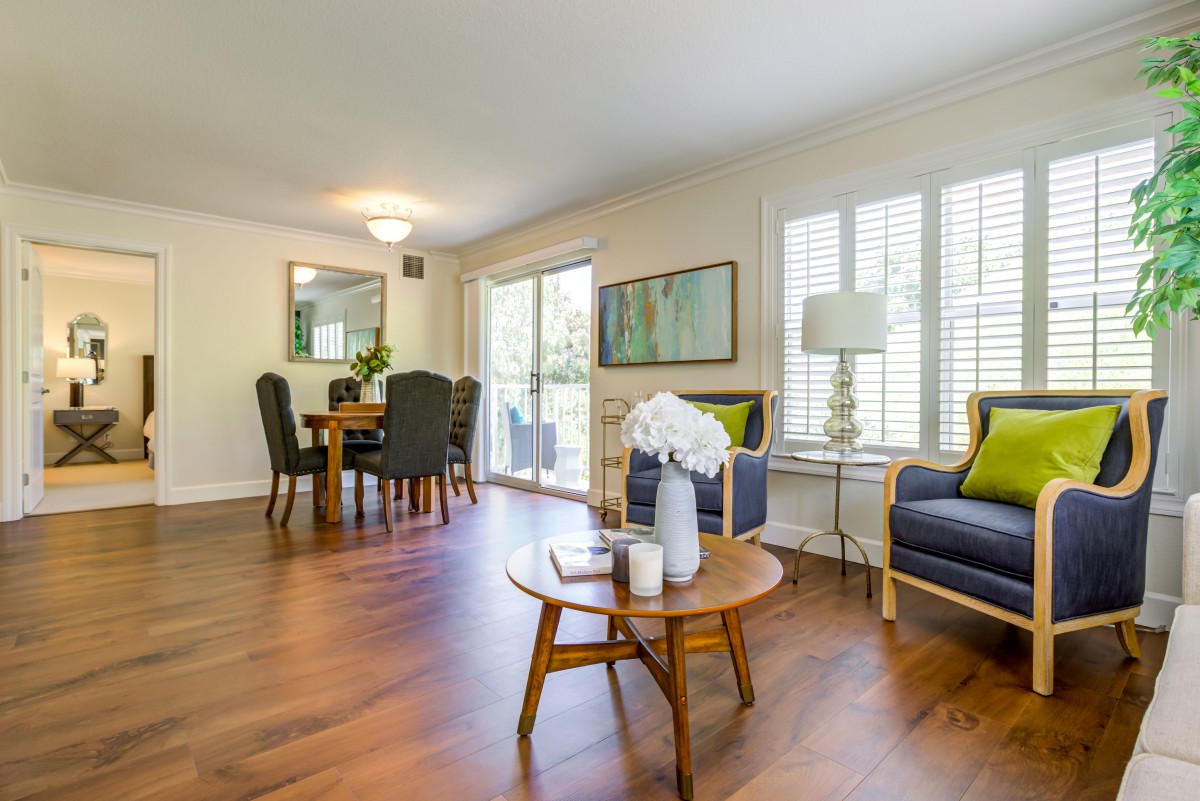 A spacious living and dining area with modern furnishings and ample natural light.