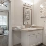 A modern bathroom with a stylish vanity area and elegant decor.