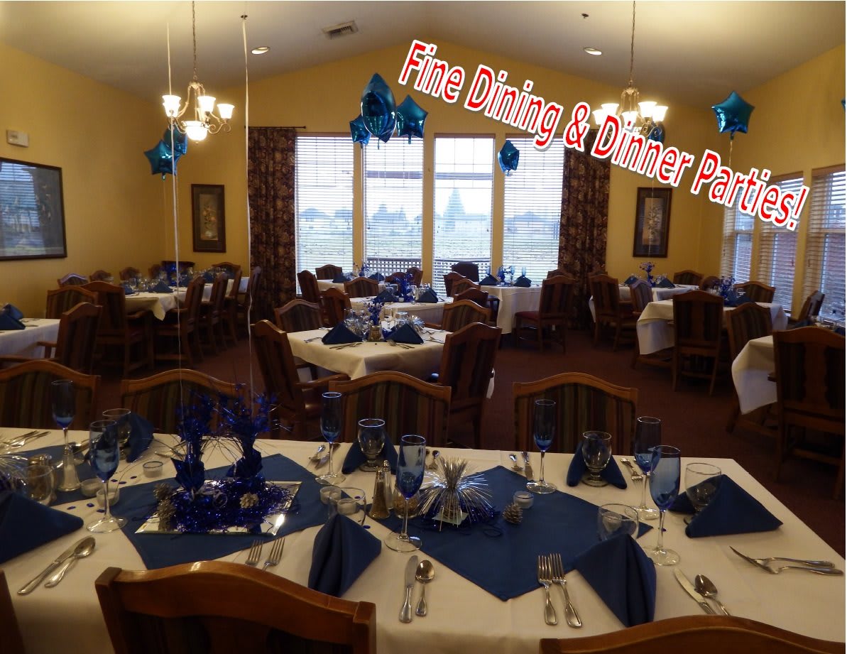 A dining room decorated with a blue theme for a special event.