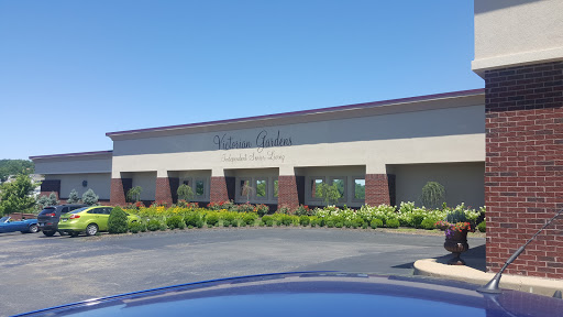 A view of a commercial building with well-maintained landscaping on a clear day.