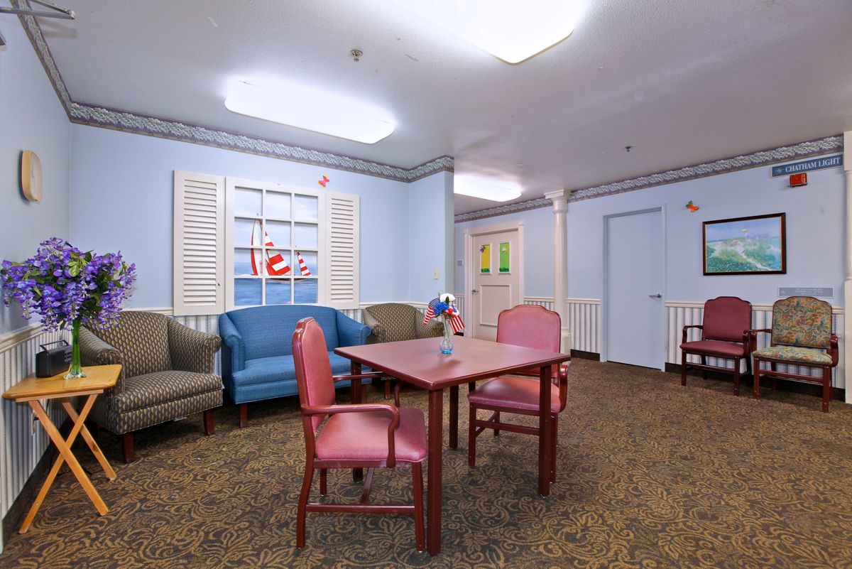 A cozy living space with colorful furniture and decor.