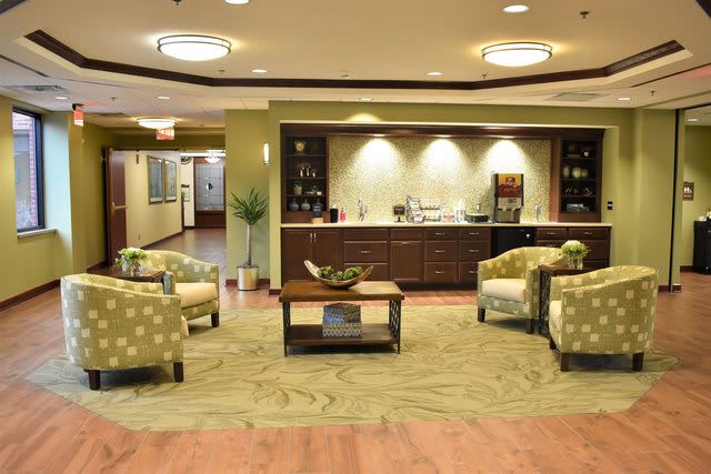 A cozy lobby area with comfortable seating and warm lighting.