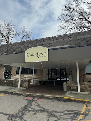 Entrance of a building with the sign 'Caf One' prominently displayed.