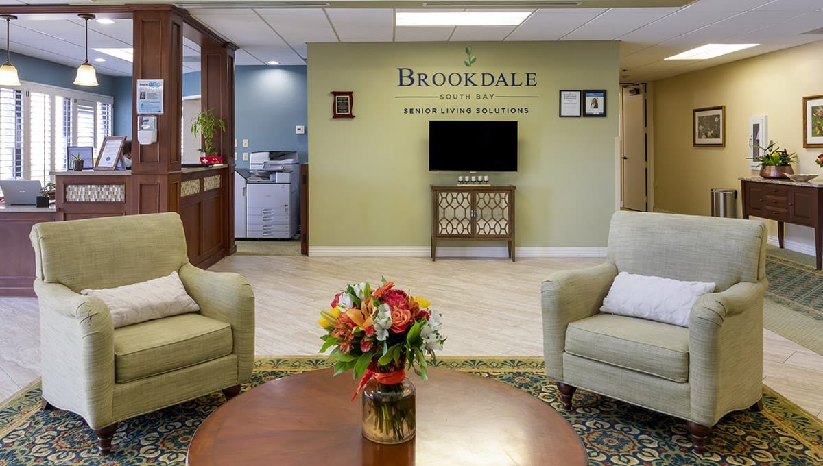 A welcoming lobby area with comfortable seating and floral decor.