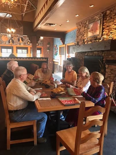 A group of people dining together in a restaurant setting.