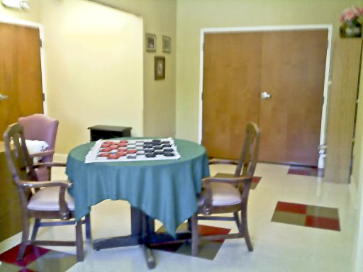 A cozy corner with a game table and chairs, ideal for gatherings.